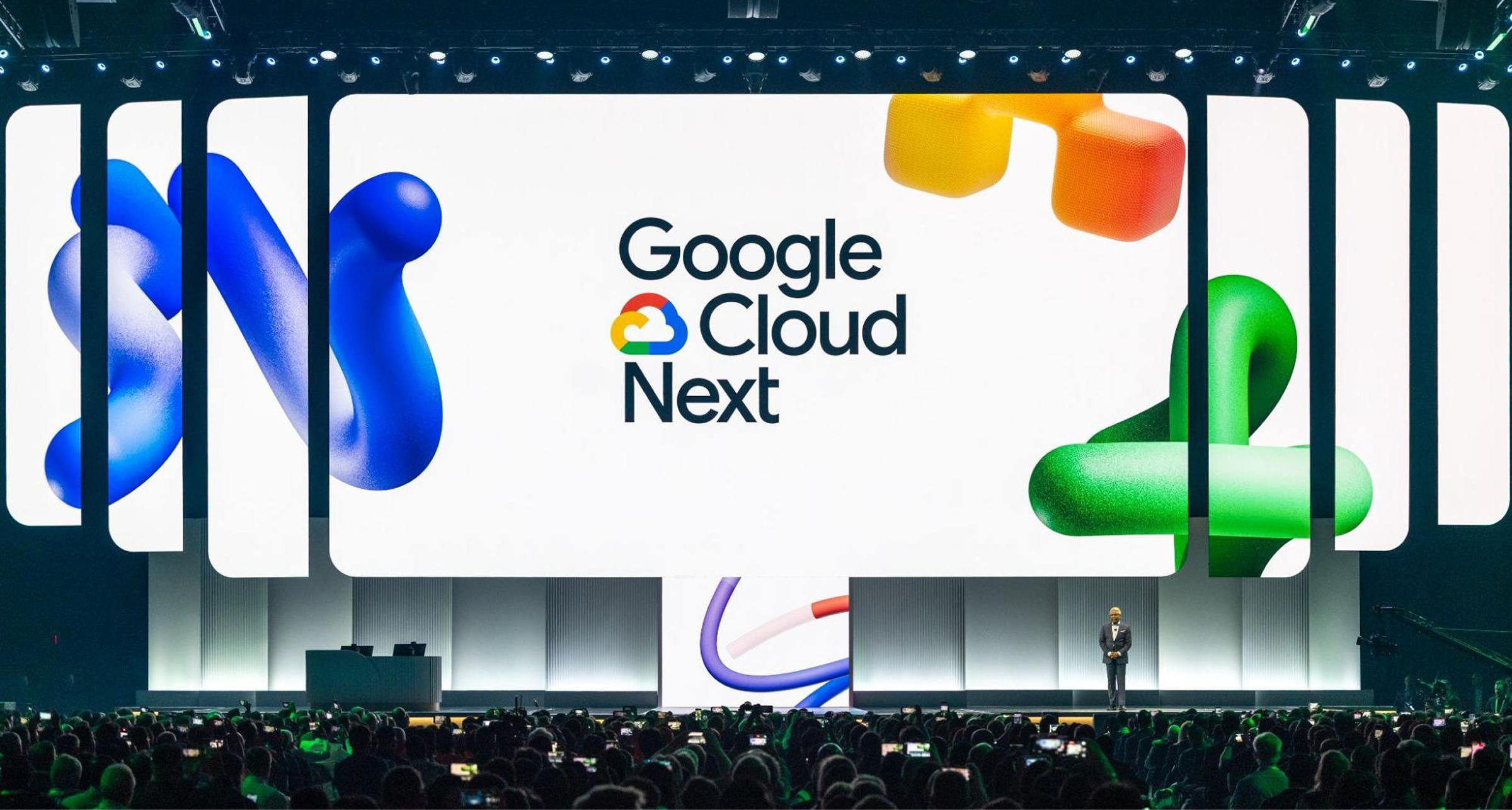 Speaker on stage at Google Cloud Next keynote as attendees capture the moment on their phones.